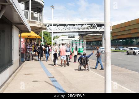 Salvador, Bahia, Brazil - August 11, 2023: People at the bus stop next to the subway in the city of Salvador, on Avenida Tancredo Neves. Bahia Brazil. Stock Photo