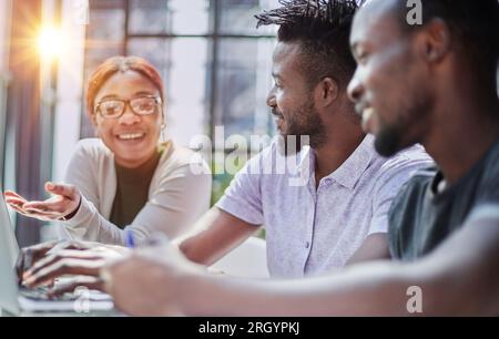 Successful collaboration. Young business people in casual wear using modern technologies and working together on new project Stock Photo