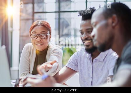 Successful collaboration. Young business people in casual wear using modern technologies and working together on new project Stock Photo