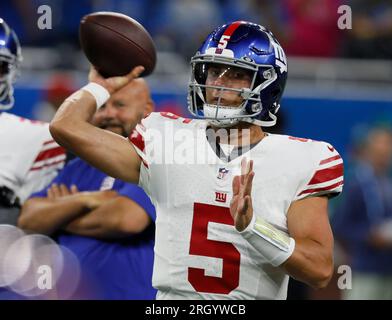 New York Giants quarterback Tommy DeVito (5) avoids Detroit Lions