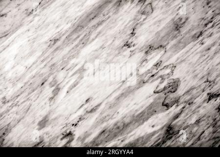 Close-up of a texture white marble surface with gray and black streaks. Stock Photo