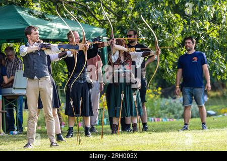 Cottbus, Germany. 12th Aug, 2023. Participants at the Elbenwald Festival practice archery under expert guidance. The Elbenwald Festival is a three-day gathering for people of all ages who enjoy movies, fantasy, games, concerts and any combination of the above. The organizers expect about 15,000 visitors. Credit: Frank Hammerschmidt/dpa/Alamy Live News Stock Photo