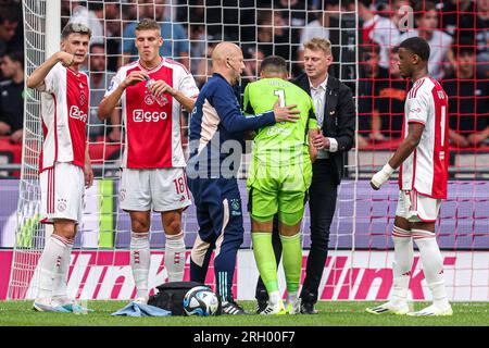 Amsterdam, Netherlands. 12th Aug, 2023. AMSTERDAM, NETHERLANDS - AUGUST 12: goalkeeper Geronimo Rulli of Ajax injured receives medical attention during the Dutch Eredivisie match between Ajax and Heracles Almelo at Johan Cruijff ArenA on August 12, 2023 in Amsterdam, Netherlands. (Photo by Peter Lous/Orange Pictures) Credit: Orange Pics BV/Alamy Live News Stock Photo
