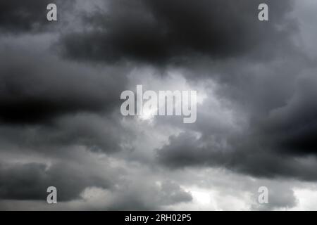 Dark grey clouds before a thunderstorm. Gloomy cloudy sky Stock Photo