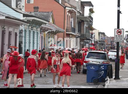 New Orleans, USA. 12th Aug, 2023. Participants of the Red Dress Run make their way through the French Quarter in New Orleans, Louisiana on Saturday, August 12, 2023. (Photo by Peter G. Forest/Sipa USA) Credit: Sipa USA/Alamy Live News Stock Photo