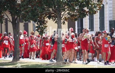 New Orleans, USA. 12th Aug, 2023. Participants of the Red Dress Run make their way down Rampart Street in New Orleans, Louisiana on Saturday, August 12, 2023. (Photo by Peter G. Forest/Sipa USA) Credit: Sipa USA/Alamy Live News Stock Photo