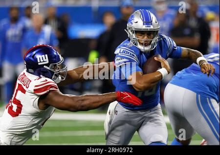 Detroit Lions quarterback Adrian Martinez (18) keeps the ball during the  second half of an NFL