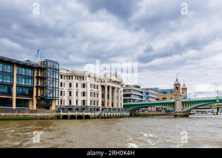 View of the riverside pillared frontage of iconic Vintners' Hall built in 1671, by Southwark Bridge on the north bank of the River Thames, London EC4 Stock Photo