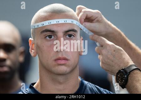 Charleston, United States. 12th Aug, 2023. An incoming freshman student known as a knob has his head measured for his uniform on Matriculation Day at the Citadel Military College in Charleston, South Carolina on Saturday, August 12, 2023. The cadet recruits arrived on a record hot and humid day to begin the traditional introduction known as Hell Week. Photo by Richard Ellis/UPI Credit: UPI/Alamy Live News Stock Photo