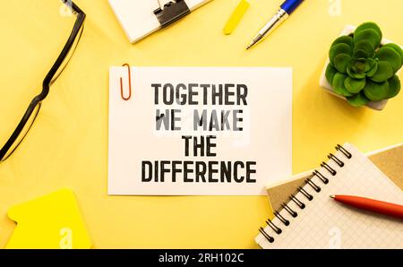 Together We Make the Difference inspirational text on yellow sticky note and red background. Stock Photo