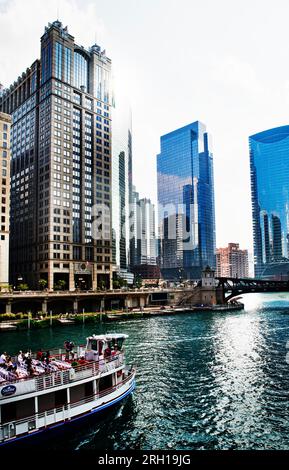 Tourist Ferry on Chicago River just passing Clark Street Bridge in ...