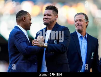 Former baseball player Adrian Beltre, left, greets former teammate