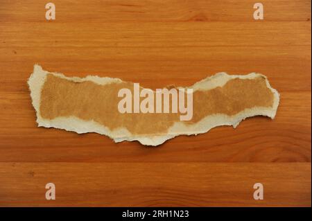pieces of brown teared cardboard isolated Stock Photo