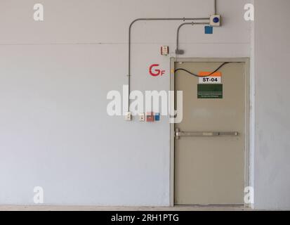 Fire exit door for emergency case of the parking building near the business office. Stock Photo