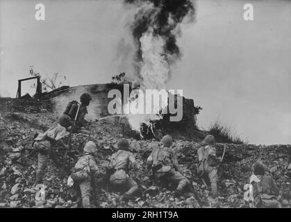 Invasion of the Philippines, December 1941 – May 1942. Imperial Japanese Army troops scorch an Allied pillbox with a flamethrower during the Battle of Bataan, January 7 – April 9 1942. Stock Photo