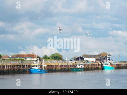 The tidal River Blyth showing fishing boats moored on the Southwold side of the river taken from Walberswick, Suffolk, East Anglia, England, UK Stock Photo