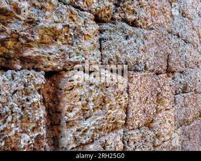 Snapshot presenting a full-frame texture of ancient masonry serving as a background. Stock Photo