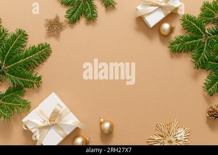 Christmas, Xmas, Noel or New Year background with winter festive Christmas holiday decoration, Christmas gift boxes and Christmas tree branches Stock Photo