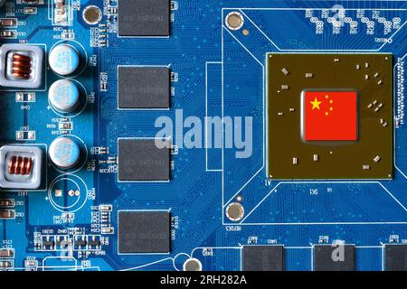 China flag on a processor, central processing unit CPU or GPU microchip on a motherboard or graphic card. Concept for the battle of global microchips Stock Photo