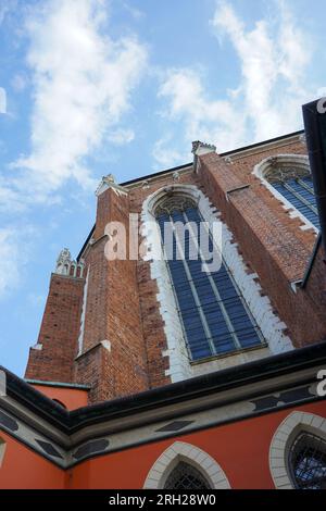 Huge red brick old building in Krakow, Poland. Old church in Poland. Stock Photo