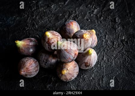 Fresh ripe figs of the Black Rimmed Bordissot variety on a dark background Stock Photo