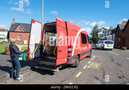 Mobile Post van serving customers in Drymen village in Stirling district, Scotland Stock Photo