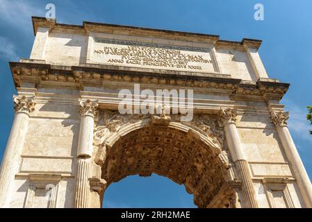 Arch of Titus on Roman Forum on sky background, Rome, Italy, Europe. Ancient Arch of Titus (Arco di Tito) is famous landmark of Roma city. Concept of Stock Photo