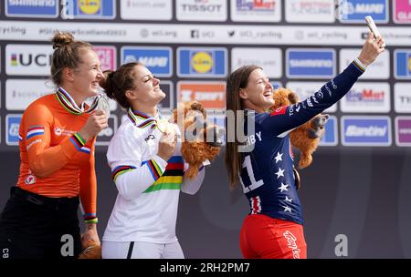 Great Britain's Bethany Shriever (centre) with her gold medal after winning the Women's U23 Final poses alongside Second placed Netherland's Laura Smulders (left) with her silver medal and third placed USA's Alise Willoughby with her bronze medal during day eleven of the 2023 UCI Cycling World Championships at the Glasgow BMX Centre, Glasgow. Picture date: Sunday August 13, 2023. Stock Photo