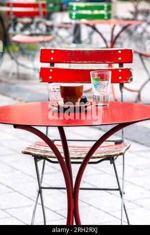 Empty cafe tables and chairs in city center - Brussels, Belgium. Stock Photo