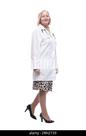 woman doctor in a white coat striding forward. isolated on a white background. Stock Photo
