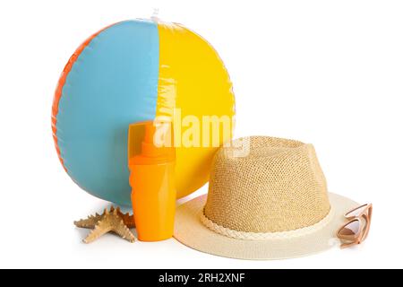 Stylish beach hat, ball, sunglasses and bottle of sunscreen on white background Stock Photo