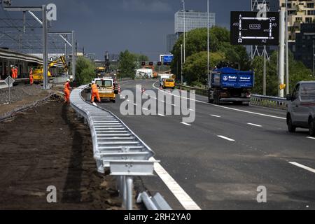 AMSTERDAM - Work on the A10 motorway, the day before the reopening. The A10 and A4 motorways and a section of train track have been temporarily closed in order to install two enormous roof sections for a passenger tunnel at Amsterdam Zuid station. ANP SANDER KONING netherlands out - belgium out Stock Photo