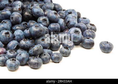 A bunch of blueberries are scattered on the table. Horizontal. Photo in high quality Stock Photo