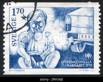 SWEDEN - CIRCA 1979: stamp printed by Sweden, shows Child Wearing Gas Mask in Heavy Traffic, circa 1979 Stock Photo