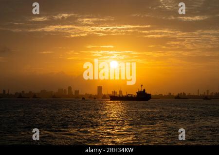 Cityscape and amazing summer sunset over the Arabian sea in Mumbai, Bombay in India. Stock Photo