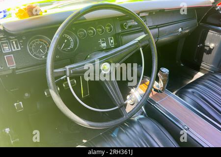 Little Elm, Texas - June 11, 2023: Plymouth Roadrunner leather interior, steering wheel. Stock Photo