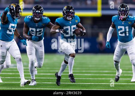 Jacksonville Jaguars cornerback Christian Braswell (36) and Dallas Cowboys  wide receiver Jose Barbon (14) pose for