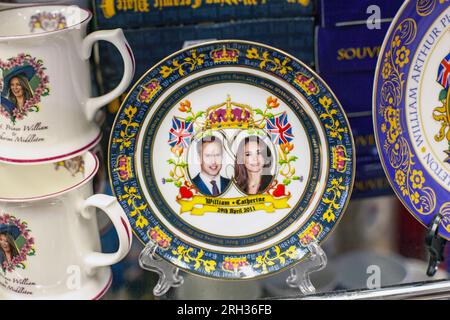 Plate featuring the portrait of Catherine, Duchess of Cambridge, and her husband Prince William is displayed at a souvenir store in London ,UK Stock Photo