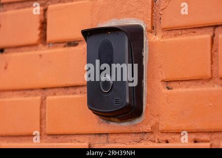 close up of a black intercom device on a brick wall Stock Photo