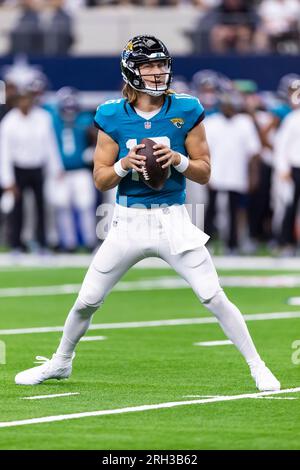 Jacksonville Jaguars quarterback Trevor Lawrence takes notes as he watches  play against the Dallas Cowboys in the second half of a preseason NFL  football game in Arlington, Texas, Sunday, Aug. 29, 2021. (