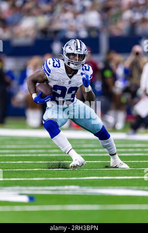 Dallas Cowboys running back Rico Dowdle (23) fumbles the ball against  Jacksonville Jaguars cornerback Gregory Junior (34) during the first half  of an NFL preseason football game, Saturday, Aug. 12, 2023, in