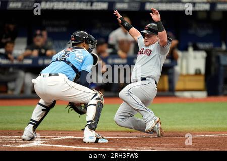 Cleveland Guardians' Kole Calhoun scores against the Tampa Bay