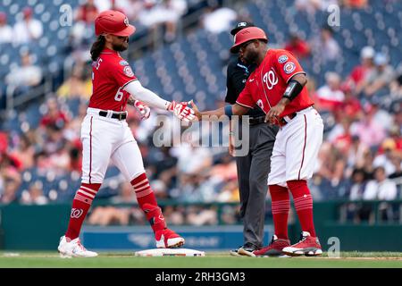 Michael Chavis of the Washington Nationals gestures after he hits