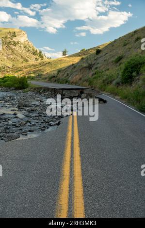 Looking Down The Yellow Stripe To Washed Out Road In Yellowstone National Park Stock Photo