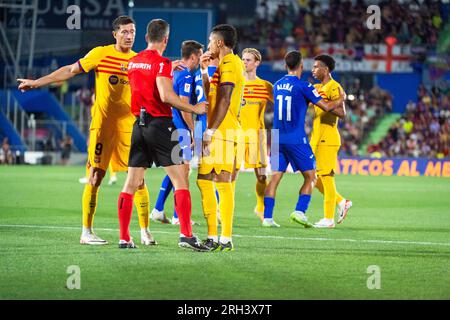 Getafe, Madrid, Spain. 13th Aug, 2023. Robert Lewandowski (Barcelona) and Raphinha (Barcelona) arguing with the referee during the LaLiga EA Sports football match between Getafe and Barcelona played at Coliseum Alfonso Perez Stadium on August 13, 2023 in Getafe, Spain (Credit Image: © Alberto Gardin/ZUMA Press Wire) EDITORIAL USAGE ONLY! Not for Commercial USAGE! Credit: ZUMA Press, Inc./Alamy Live News Stock Photo