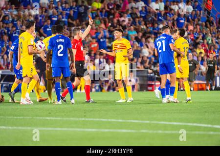 Getafe, Madrid, Spain. 13th Aug, 2023. Referee shows red card to Raphinha (Barcelona) and Pedri (Barcelona) protests during the LaLiga EA Sports football match between Getafe and Barcelona played at Coliseum Alfonso Perez Stadium on August 13, 2023 in Getafe, Spain (Credit Image: © Alberto Gardin/ZUMA Press Wire) EDITORIAL USAGE ONLY! Not for Commercial USAGE! Credit: ZUMA Press, Inc./Alamy Live News Stock Photo