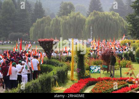 August 13, 2023, Srinagar, Jammu and Kashmir, India: BJP Members and locas hold National flags as they take part in 'Meri Maati Mera Desh' (My soil, My country) bike and road walk rally ahead of Independence Day celebrations on August 12, 2023 in Srinagar, India. (Credit Image: © Mubashir Hassan/Pacific Press via ZUMA Press Wire) EDITORIAL USAGE ONLY! Not for Commercial USAGE! Stock Photo