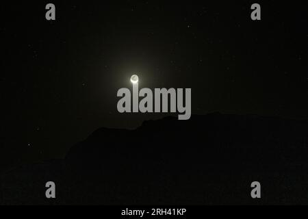 Faiyum, Egypt. 13th Aug, 2023. The moon is seen over the natural reserve area of Wadi Al-Hitan (Valley of the Whales) at the desert of Al Fayoum Governorate. Credit: Gehad Hamdy/dpa/Alamy Live News Stock Photo