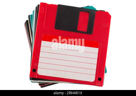 Colored old retro floppy diskettes in stack. Isolated on white background. Stock Photo