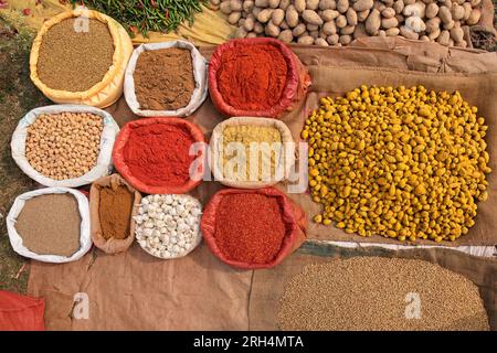 Colorful spices displayed in an informal rural outdoor market, India Stock Photo